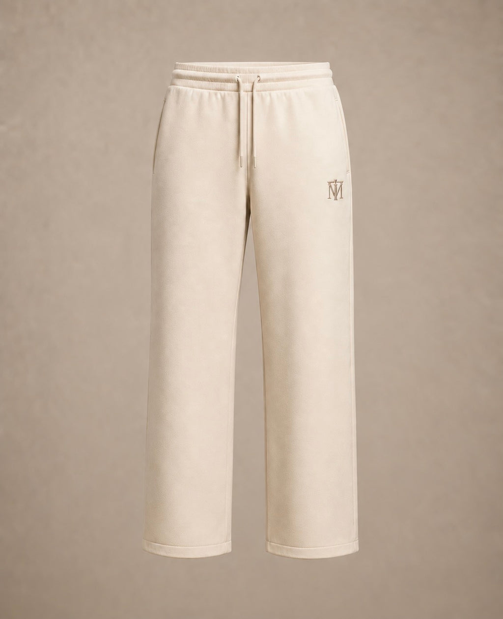 Cream-colored wide-leg sweatpants with a drawstring waist and a small embroidered logo on the left leg, shown against a neutral beige background.
